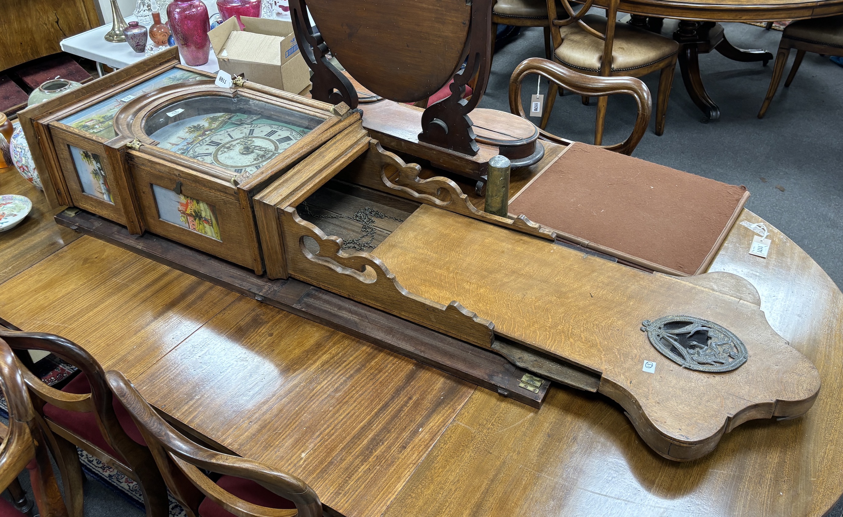 An oak cased Dutch wall clock with arched painted dial, case inset painted landscape panels, height 140cm